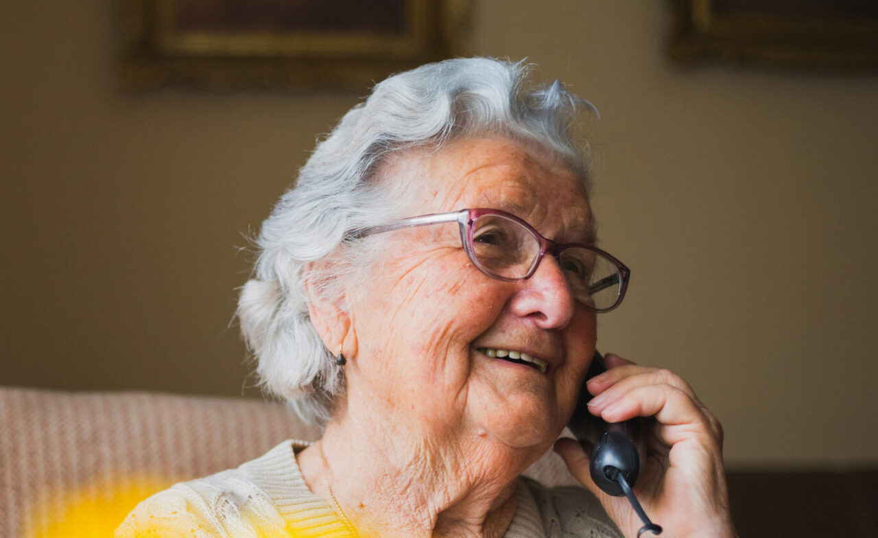 Portrait of an older woman talking on the phone